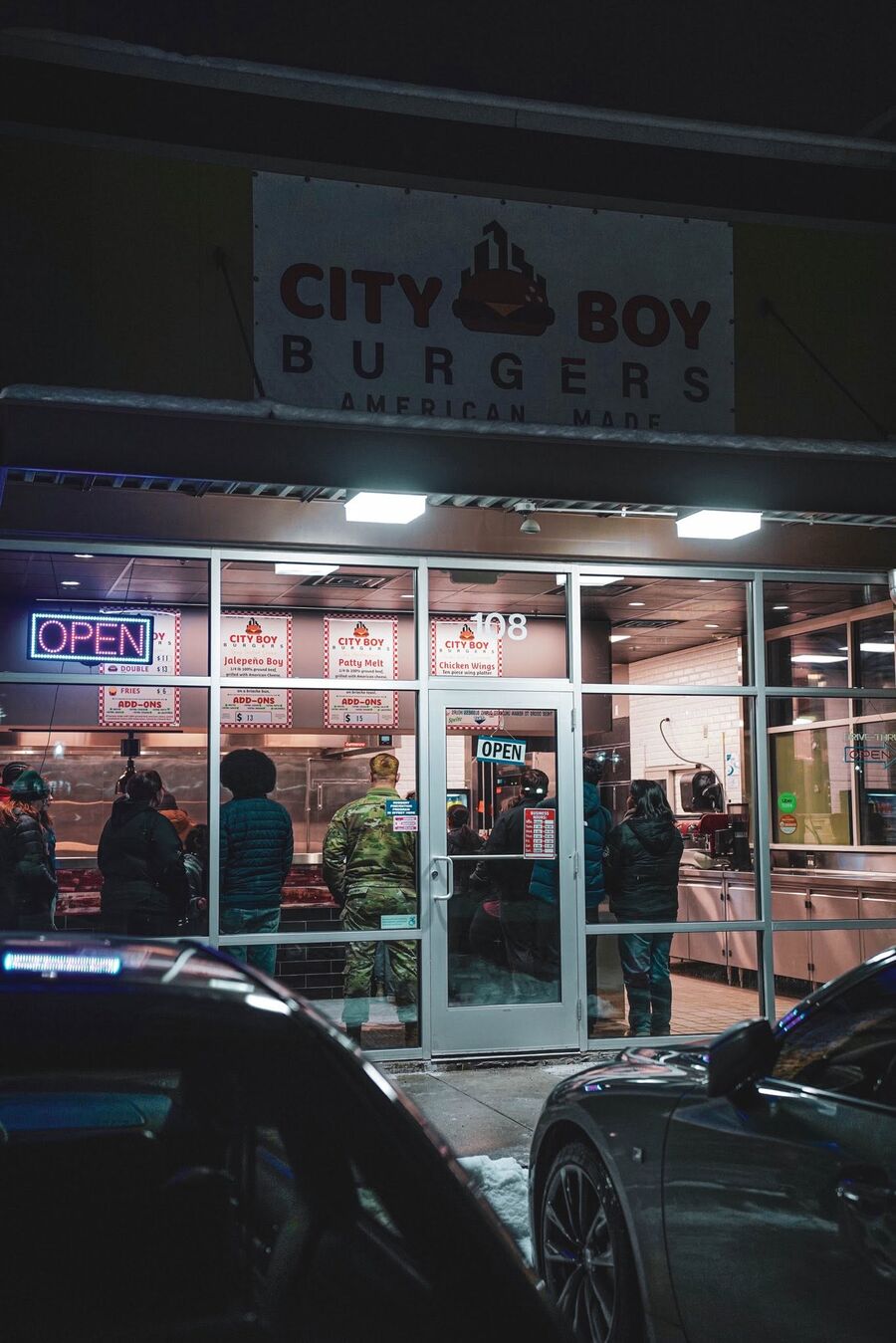 The City Boy Burgers storefront lit up at night in Mountain View